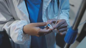 A doctor is holding a needle and a syringe video