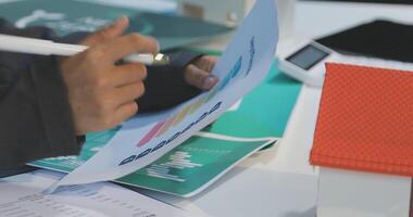 A person is working on a document with a pen video