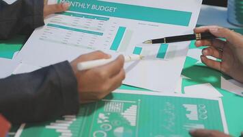 Two people are working on a budget document video
