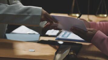 A judge handing a document to a person video