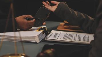 A lawyer signing a contract with a client video