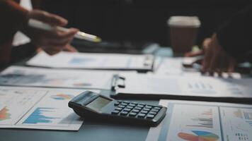 Business people working on a table with a calculator and papers video