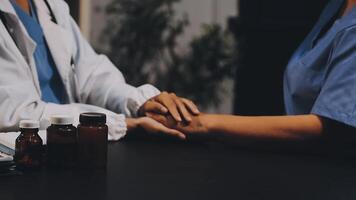 A doctor holding hands with another person video
