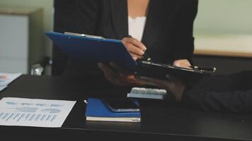 Two business people are working on a document video