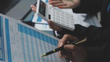 Businessman using calculator and pen to calculate the tax video