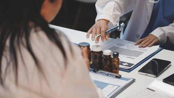A doctor is talking to a patient at a desk video