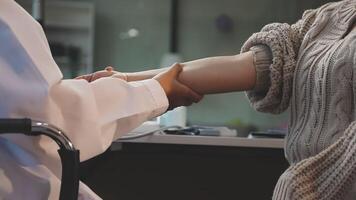 A doctor is shaking hands with a patient video