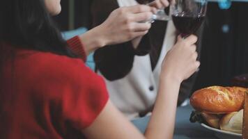 A couple toasting with wine glasses video
