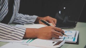A person is writing on a piece of paper with a pen video