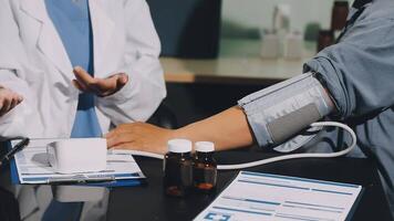A doctor checking blood pressure of a patient video