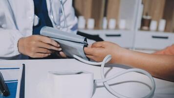 A doctor checking the blood pressure of a patient video