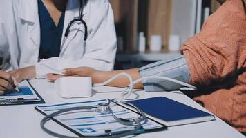 A doctor is talking to a patient video
