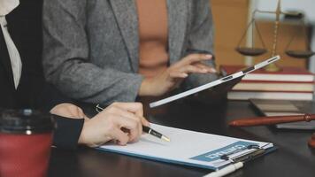 A lawyer and a client are working on a document video