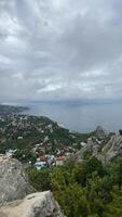 A view of the town and ocean from the top of a mountain video