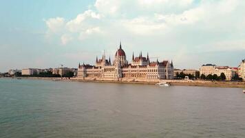 Hungarian Parliament Building in Budapest at sunset with reflection in Danube River, aerial view. Neo Gothic architecture and famous landmark of Hungary video