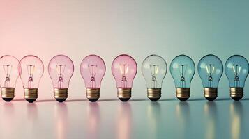 A series of light bulbs arranged in a row against a vibrant, colorful background. The empty space allows for a message or idea to be added, symbolizing creativity and business innovation photo