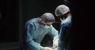 Performing laparoscopic surgery in a well-equipped operating room. The work of the surgeon and assistant during the operation. 4k, red komodo video