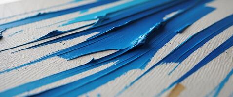 Closeup of a canvas with textured background and abstract blue brush strokes photo