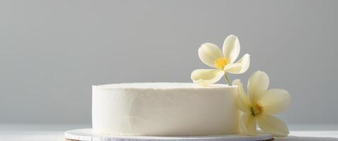 a close up of a white cake with a flower on top. photo