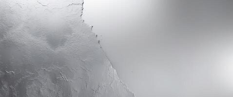 Abstract background with a textured surface and a silver metallic gradient. photo