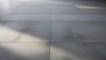 Gray concrete floor tiles with shadows and soft light Copy Space photo