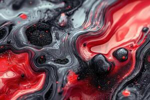Abstract background with flowing red and black paint photo