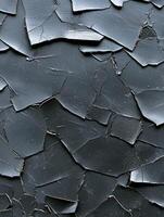 Close up of peeling black paint creating a textured background photo