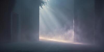 Mysterious fog and light illuminate a dark space creating an atmospheric ambiance. photo