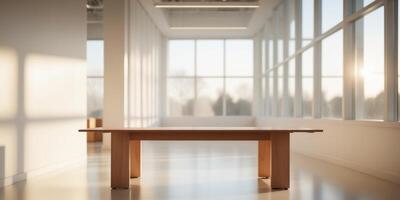 Wooden table in light office with panoramic windows. photo