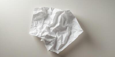 Crumpled paper creating a textured effect with highlights and shadows. photo