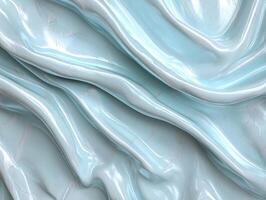Abstract light blue fabric with shiny texture and soft folds photo