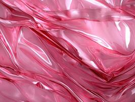 Abstract pink shiny fabric with flowing folds photo