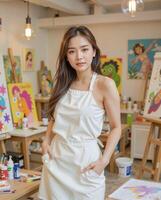 Portrait of Young Artist in White Apron at Colorful Creative Studio photo