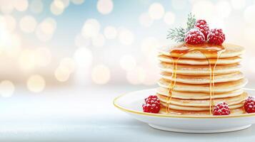 Stacking gold pancakes with honey, topped with fresh raspberries and powdered sugar, copy space photo