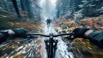 A person riding a mountain bike through a snowy forest photo