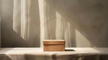 A box sitting on a table in front of a window photo