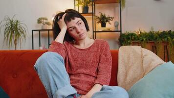 Sad lonely Caucasian girl looks pensive thinks over life concerns suffers from unfair situation video