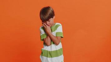Child boy kid touching cheek, closing eyes with expression of terrible suffer from painful toothache video