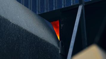 Flashes of fire in the aperture between the elevator parts. Burning fire for the drying of grain in the grain elevator for storage crop. video