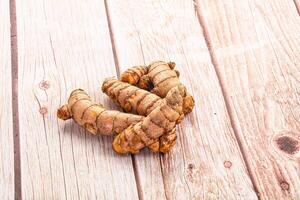 Fresh raw asian tumeric roots photo