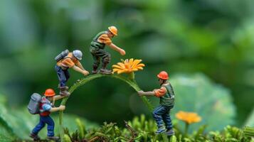Miniature workers balancing on a flower stem, symbolizing teamwork in nature. photo