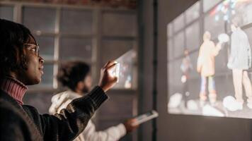 Closeup of a participants focused expression as they engage with a holographic interface with colorful product prototypes vividly animated in the background.. photo