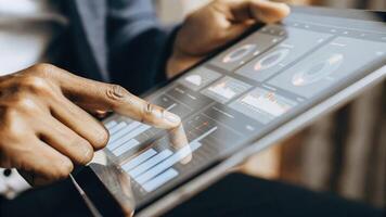 A closeup on a holographic interface displaying userfriendly metrics and analytics with fingers skillfully navigating through various investment options creating an engaging visual. photo