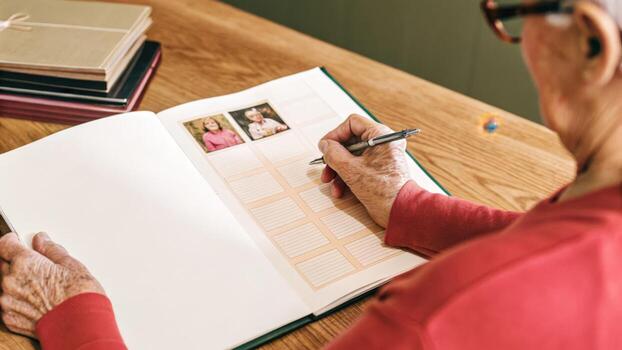 A senior citizen reviewing a printed health report generated by AI analysis with a pen in hand engaged in making notes to discuss with a family member.. photo