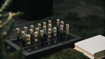 An artistic arrangement of a microscope test tubes with labels and a miniature lab manual emphasizing the handson nature of DIY experiments.. photo