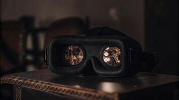 A closeup of a VR headset resting on a table with holographic images reflecting off its surface indicating enhanced tech integration for immersive pitches.. photo