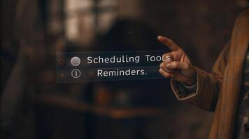 A dynamic closeup of a holographic calendar interface depicting scheduling tools and reminders while a person points to select a date.. photo