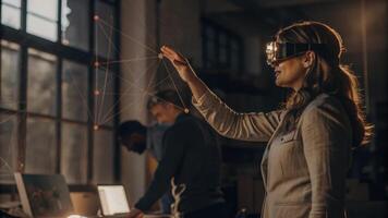 A woman engaged in a brainstorming session using augmented reality glasses to visualize global market trends projected above her workspace.. photo
