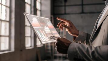 An exeive reviewing portfolio performance metrics on a holographic terminal with hover menus and interactive elements enhancing user engagement.. photo