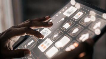 A closeup of hands manipulating a tactile holographic screen with bright icons and information appearing in midair showcasing an intuitive user interface for complex project. photo